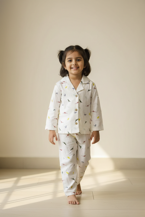honey hugs kids cream dino print linen co ord set worn by girl indoors