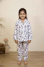 Girl wearing white airplane print pajama set