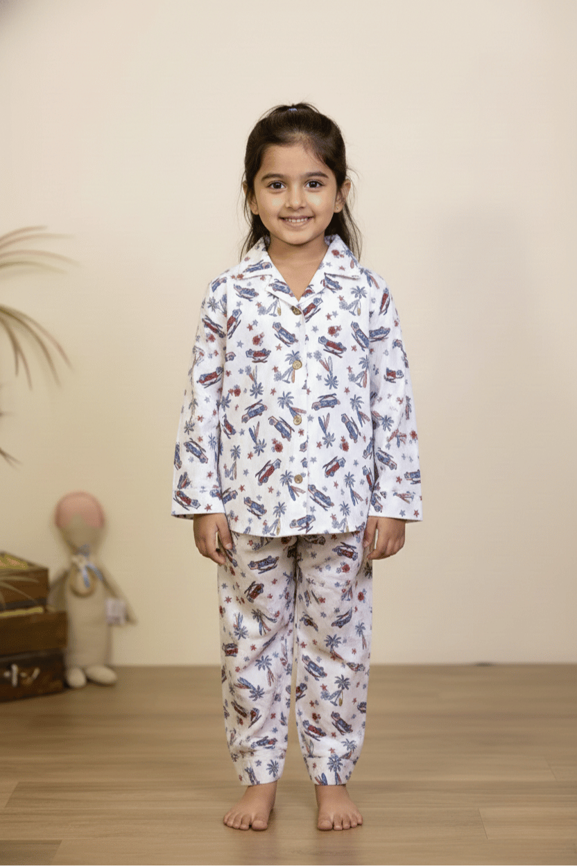Girl wearing white airplane print pajama set