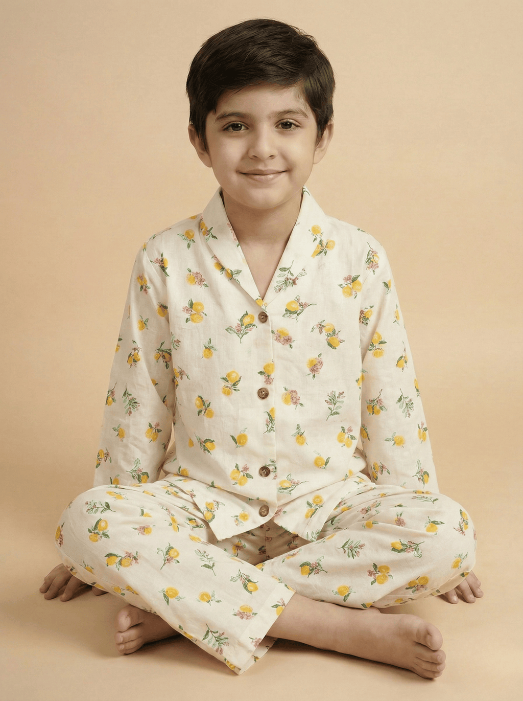 Child wearing a floral pajama set on a beige background