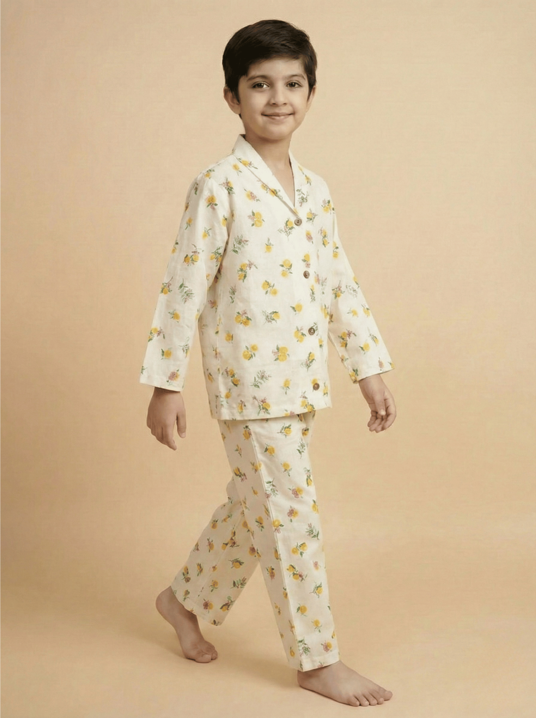 Child wearing a white floral pajama set on a beige background